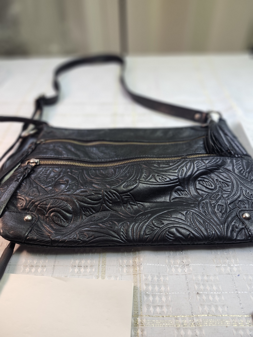 The Sak Black Floral-Embossed Leather Crossbody Bag